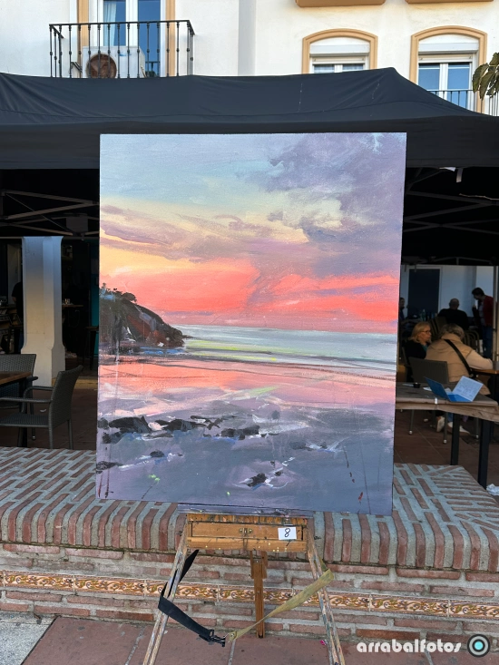 Cuadro de un atardecer en La Cala del Moral presentado al concurso de pintura de la Semana Sociocultural.